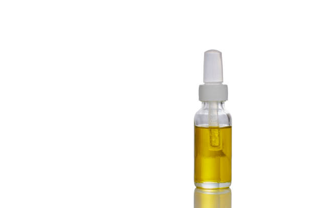 istock Medicinal cannabis with extract oil in a bottle on white background 1155402278