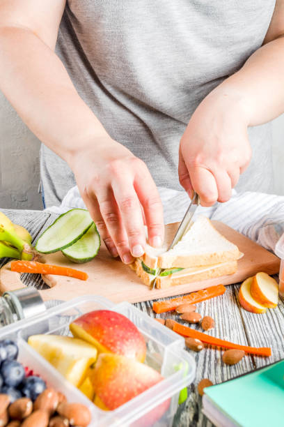 istock Mother preparing school lunch box 1155403410