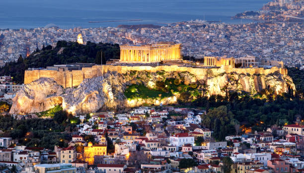 istock Athens skyline panorama with Acropolis in Greece from peak Lycabettus at night 1155403536