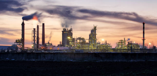 istock Factory pipe polluting air, smoke from chimneys against sun, environmental problems, ecological theme, industry scene 1155403593
