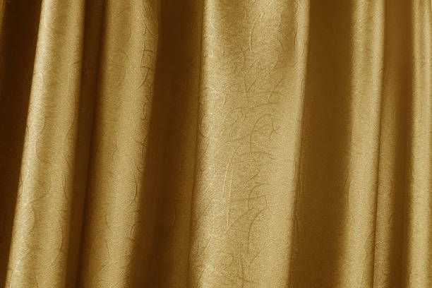 istock luxury premium gold curly curtain for background texture 1155406482