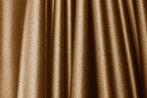 istock luxury premium gold wavy curtain for background texture 1155407467