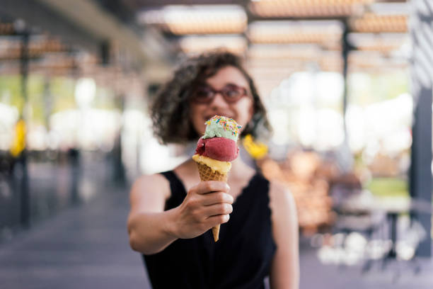 istock Woman Eating Ice Cream 1155407568