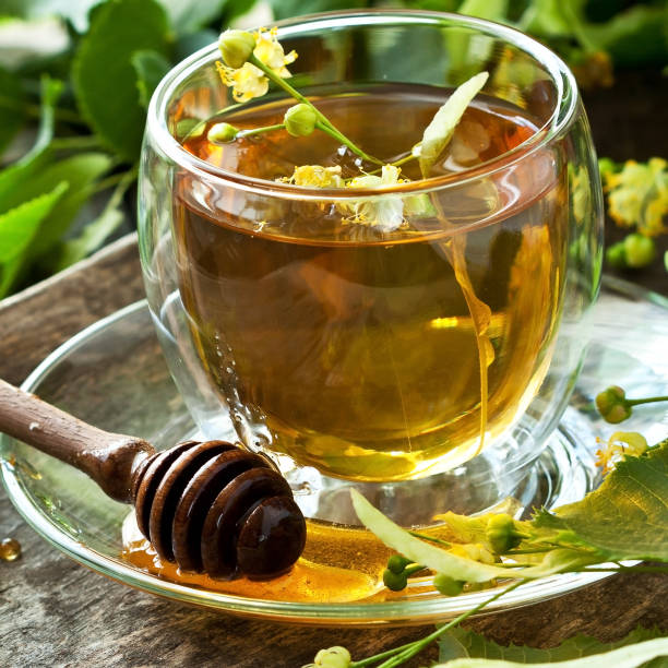 istock Cup of herbal tea with linden flowers 1155410213