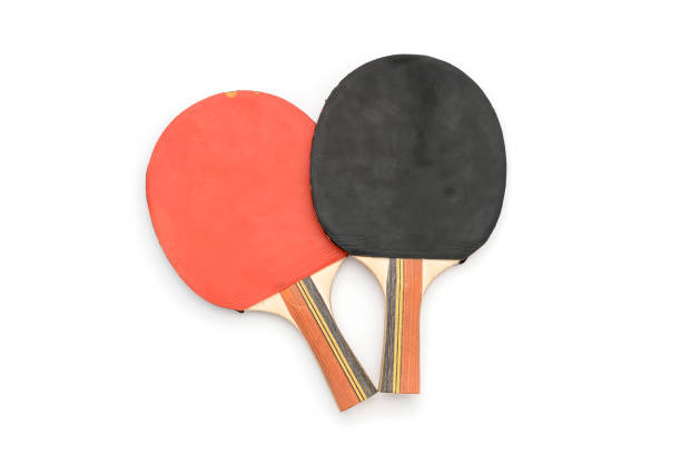 two old red and black table tennis rackets, isolated on white