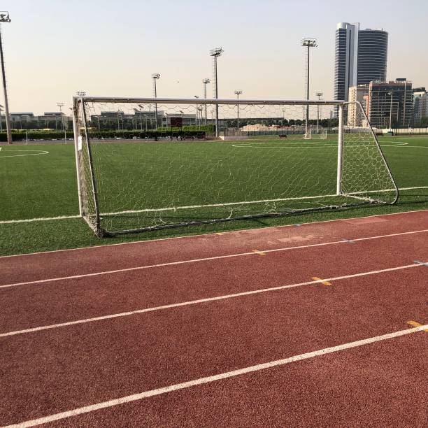 istock Athletics track and football goal 1155413151