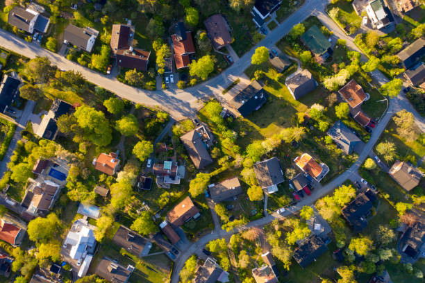 istock Top view, flying over idyllic villa area early morning 1155413307
