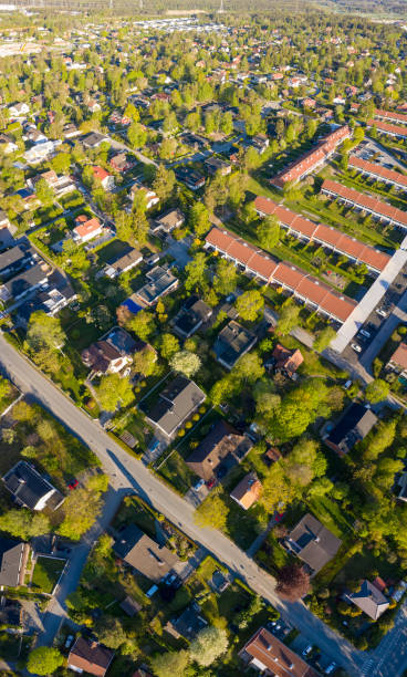 istock Top view, flying over idyllic villa area early morning 1155413388