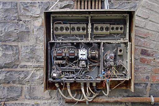 Old fuse box with chaotic cables