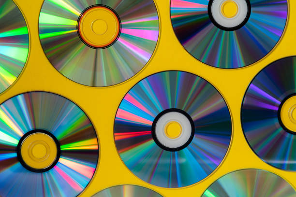 istock Vintage CD or DVD disk background, old circle discs used for data storage, share movies and music 1155415554