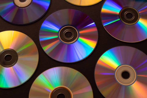 istock Vintage CD or DVD disk background, old circle discs used for data storage, share movies and music 1155415608