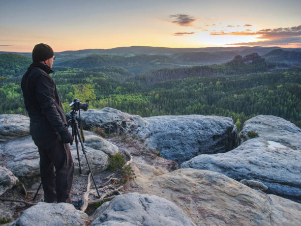 istock Photographer traveler thinking and set  tripod for camera 1155417283