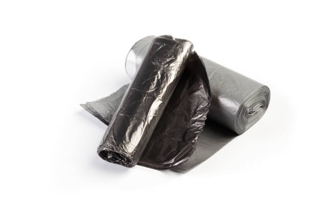istock roll of plastic garbage bags isolated on white background 1155418002