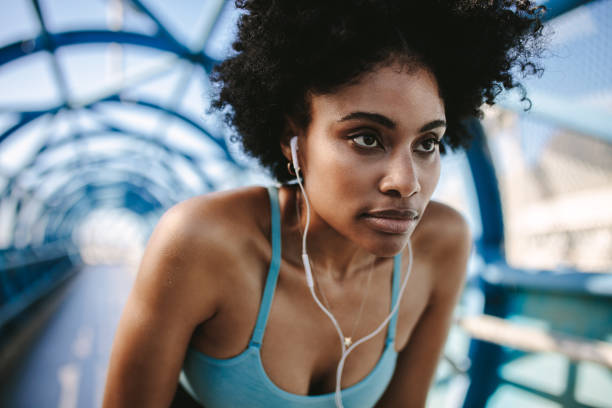 istock Motivated and focused woman runner 1155419287
