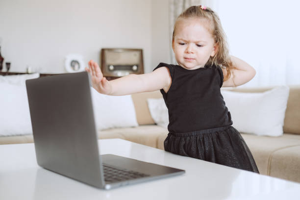 little student girl with laptop pc at home - child computer laptop little girls imagens e fotografias de stock