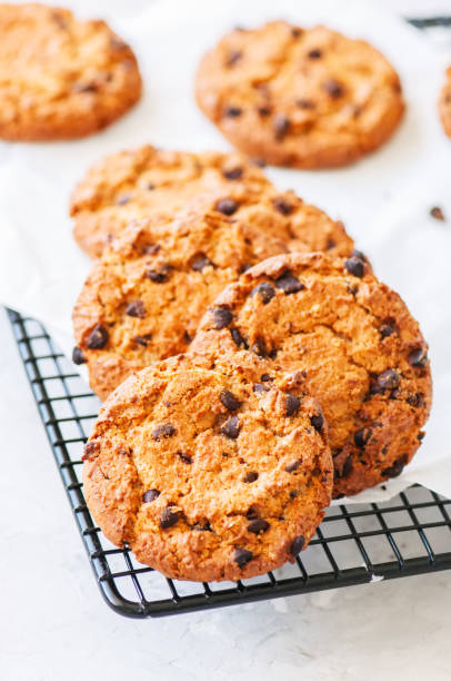 istock Homemade chocolate chips cookies on a wire rack. 1155419903