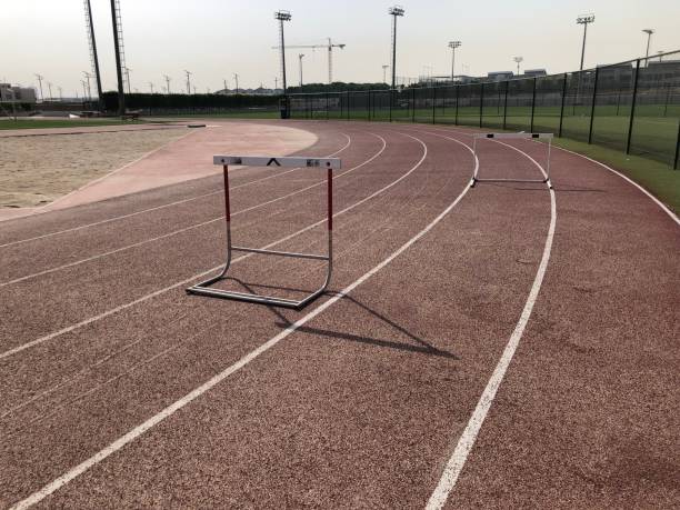 istock Single Athletics hurdle around a running track bend 1155420528