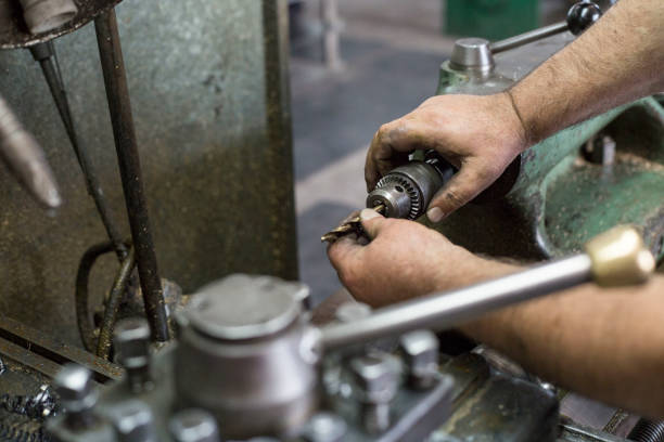 istock A man in a metallurgical workshop uses a lathe for processing metal objects for the production of gas boilers. 1155420557