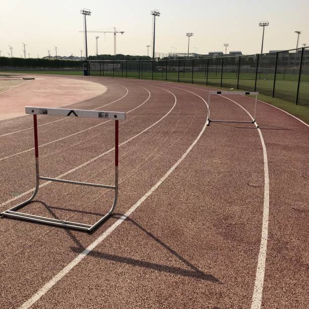 istock Single Athletics hurdle around a running track bend 1155420793