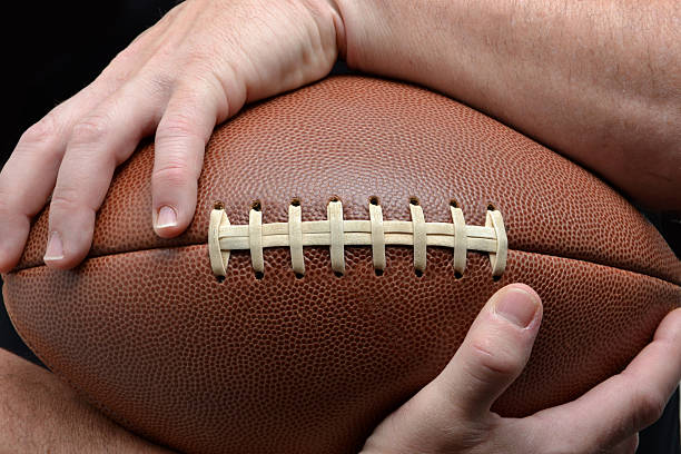 istock Holding Football 115542097