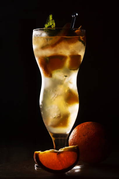 istock Kinnow fruit juice in black background 1155424462