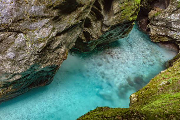 istock Crystal clear emerald mountain river flows between rocks in a deep canyon Tolmin Gorge in Triglav national park,Primorska, Slovenia,Julian Alps,Europe 1155424555