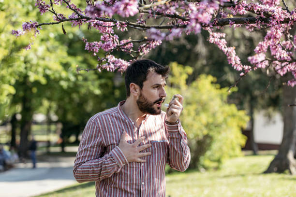 istock Man Using Asthma Inhaler Outdoor 1155424931