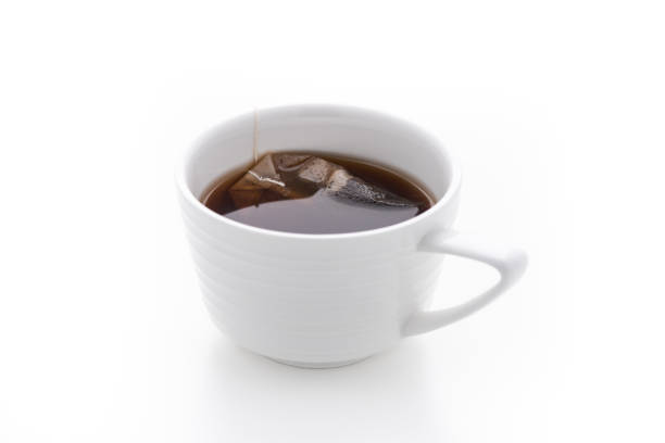 istock black tea in white cup on isolated white background 1155425971