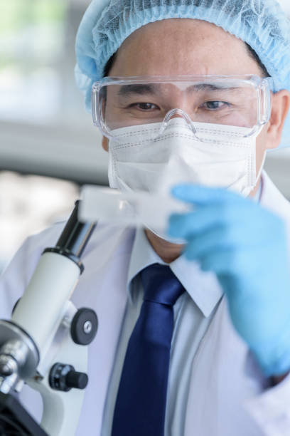 istock Asian man scientist researching  and learning in a laboratory. 1155429909