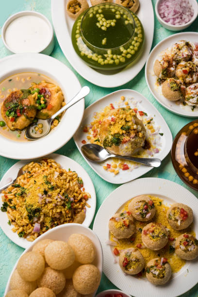 Bombay Chat food in group group of Bombay chat food includes golgappa/panipuri, bhel-puri, sev-poori, dahipuri, Ragda pattice, raj kachori etc. selective focus raj kachori stock pictures, royalty-free photos & images