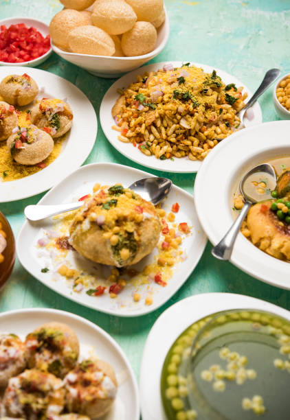 Bombay Chat food in group group of Bombay chat food includes golgappa/panipuri, bhel-puri, sev-poori, dahipuri, Ragda pattice, raj kachori etc. selective focus raj kachori stock pictures, royalty-free photos & images