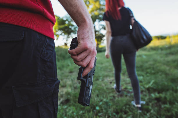 istock Thief preparing his ambush towards a young unsuspecting girl 1155432362