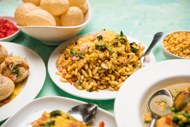 Bombay Chat food in group group of Bombay chat food includes golgappa/panipuri, bhel-puri, sev-poori, dahipuri, Ragda pattice, raj kachori etc. selective focus raj kachori stock pictures, royalty-free photos & images