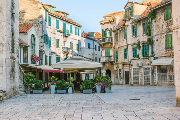 City of Split, Croatia, early morning on the Fruit Square in the Diocletians Palace City of Split, Croatia, cafes and shops on an early morning on the Fruit Square in the Diocletians Palace section of Old Town split croatia stock pictures, royalty-free photos & images