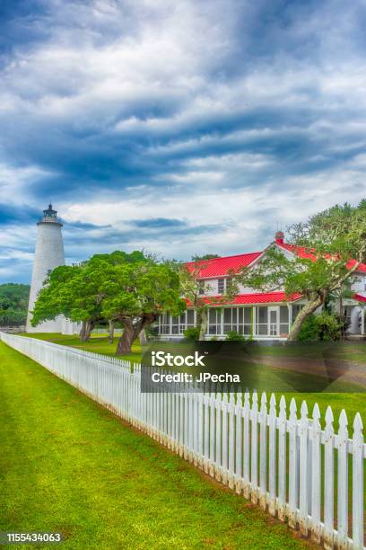 Ocracoke Lighthouse Vertical Dramatic Sky Stock Photo - Download Image Now - Ocracoke Island, Outer Banks - North Carolina, Beach
