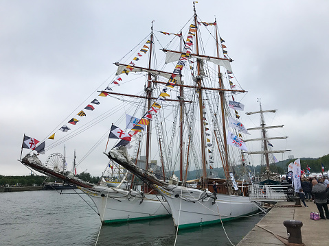 12 June 2019, Rouen France : Two white frigate of the French Navy called the Belle Poule and l Etoile at the Armada 2019 edition along the quays of the port of Rouen Normandy France