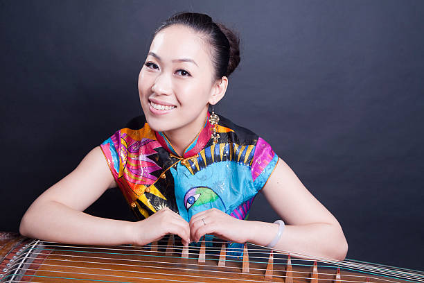 istock young women and Chinese zither 115543816