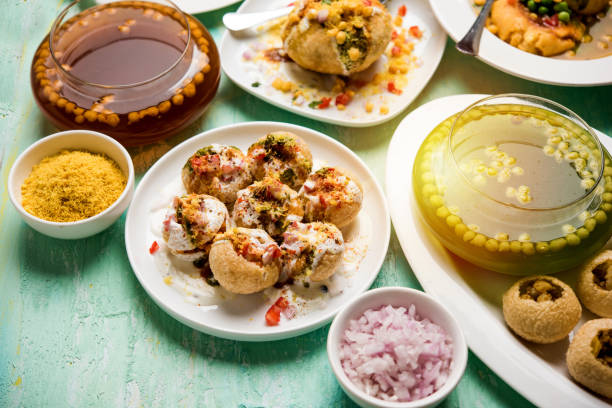 Bombay Chat food in group group of Bombay chat food includes golgappa/panipuri, bhel-puri, sev-poori, dahipuri, Ragda pattice, raj kachori etc. selective focus raj kachori stock pictures, royalty-free photos & images