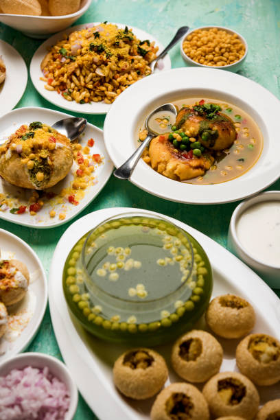 Bombay Chat food in group group of Bombay chat food includes golgappa/panipuri, bhel-puri, sev-poori, dahipuri, Ragda pattice, raj kachori etc. selective focus raj kachori stock pictures, royalty-free photos & images