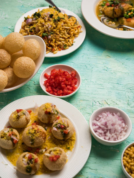 Bombay Chat food in group group of Bombay chat food includes golgappa/panipuri, bhel-puri, sev-poori, dahipuri, Ragda pattice, raj kachori etc. selective focus raj kachori stock pictures, royalty-free photos & images