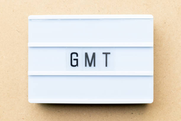 istock White lightbox with word GMT (abbreviation of Greenwich Mean Time) on wood background 1155441199