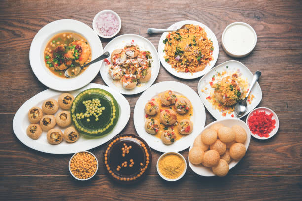 Bombay Chat food in group group of Bombay chat food includes golgappa/panipuri, bhel-puri, sev-poori, dahipuri, Ragda pattice, raj kachori etc. selective focus raj kachori stock pictures, royalty-free photos & images