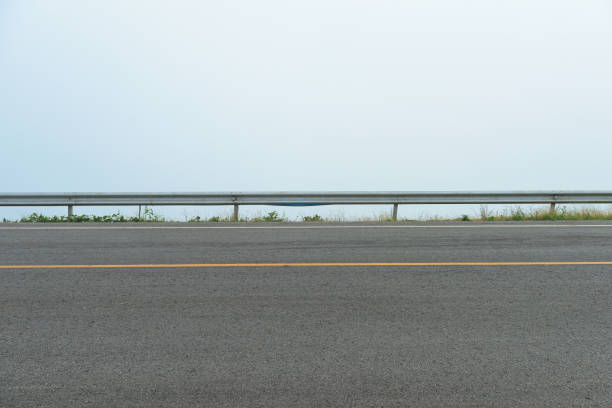 istock Asphalt road side view and Foggy 1155442171