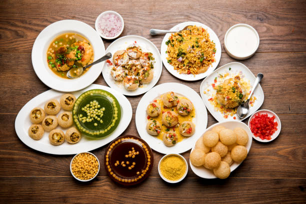 Bombay Chat food in group group of Bombay chat food includes golgappa/panipuri, bhel-puri, sev-poori, dahipuri, Ragda pattice, raj kachori etc. selective focus raj kachori stock pictures, royalty-free photos & images