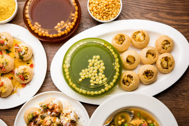 Bombay Chat food in group group of Bombay chat food includes golgappa/panipuri, bhel-puri, sev-poori, dahipuri, Ragda pattice, raj kachori etc. selective focus raj kachori stock pictures, royalty-free photos & images
