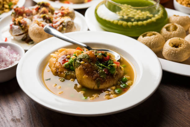 Bombay Chat food in group group of Bombay chat food includes golgappa/panipuri, bhel-puri, sev-poori, dahipuri, Ragda pattice, raj kachori etc. selective focus raj kachori stock pictures, royalty-free photos & images
