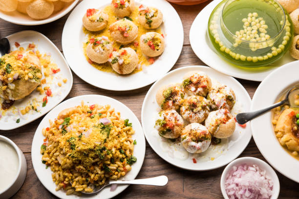 Bombay Chat food in group group of Bombay chat food includes golgappa/panipuri, bhel-puri, sev-poori, dahipuri, Ragda pattice, raj kachori etc. selective focus raj kachori stock pictures, royalty-free photos & images