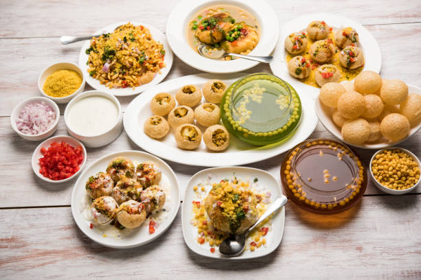Bombay Chat food in group group of Bombay chat food includes golgappa/panipuri, bhel-puri, sev-poori, dahipuri, Ragda pattice, raj kachori etc. selective focus raj kachori stock pictures, royalty-free photos & images