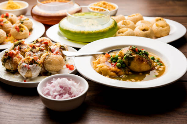 Bombay Chat food in group group of Bombay chat food includes golgappa/panipuri, bhel-puri, sev-poori, dahipuri, Ragda pattice, raj kachori etc. selective focus raj kachori stock pictures, royalty-free photos & images
