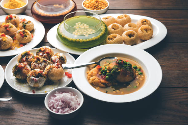 Bombay Chat food in group group of Bombay chat food includes golgappa/panipuri, bhel-puri, sev-poori, dahipuri, Ragda pattice, raj kachori etc. selective focus raj kachori stock pictures, royalty-free photos & images